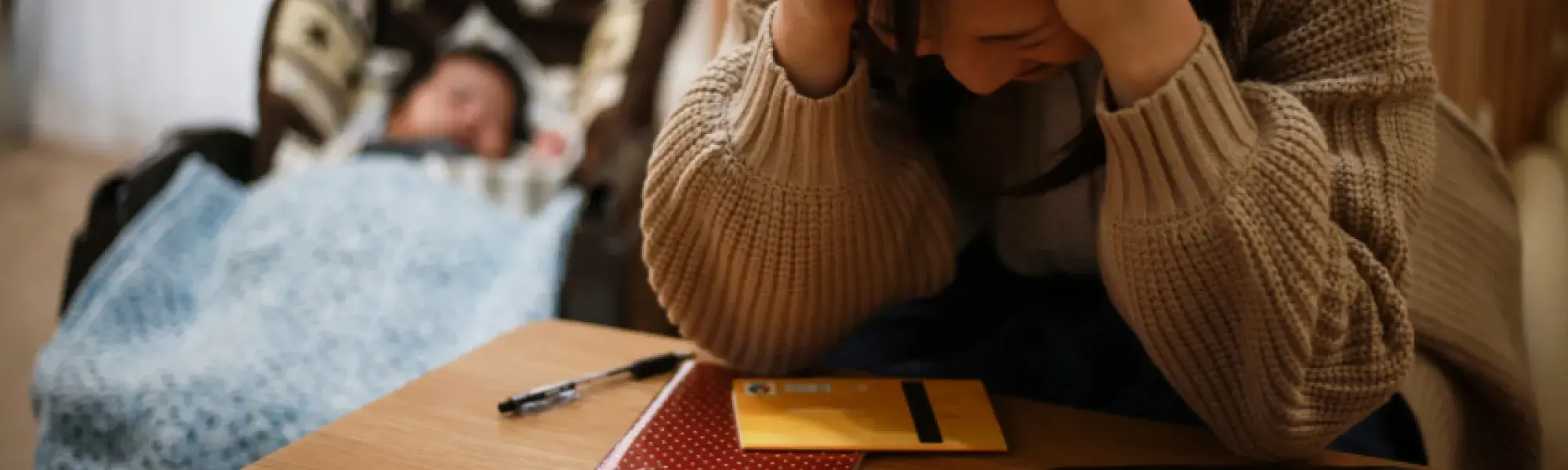lady holding hands on head in stress